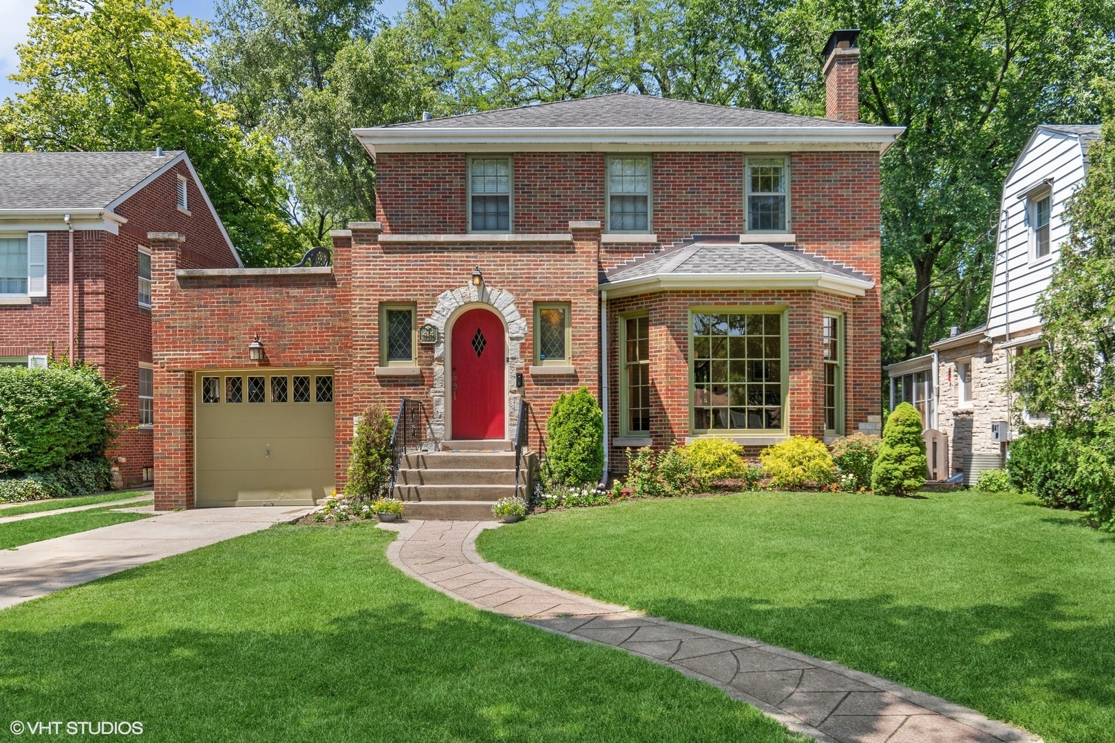 a front view of house with yard and green space