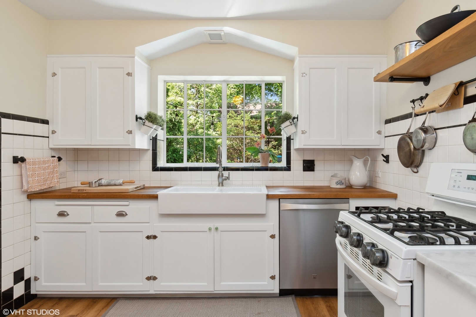 414 Audubon Road Riverside, IL 60546 - Photo 14 of 51 a kitchen with a stove a sink and a window