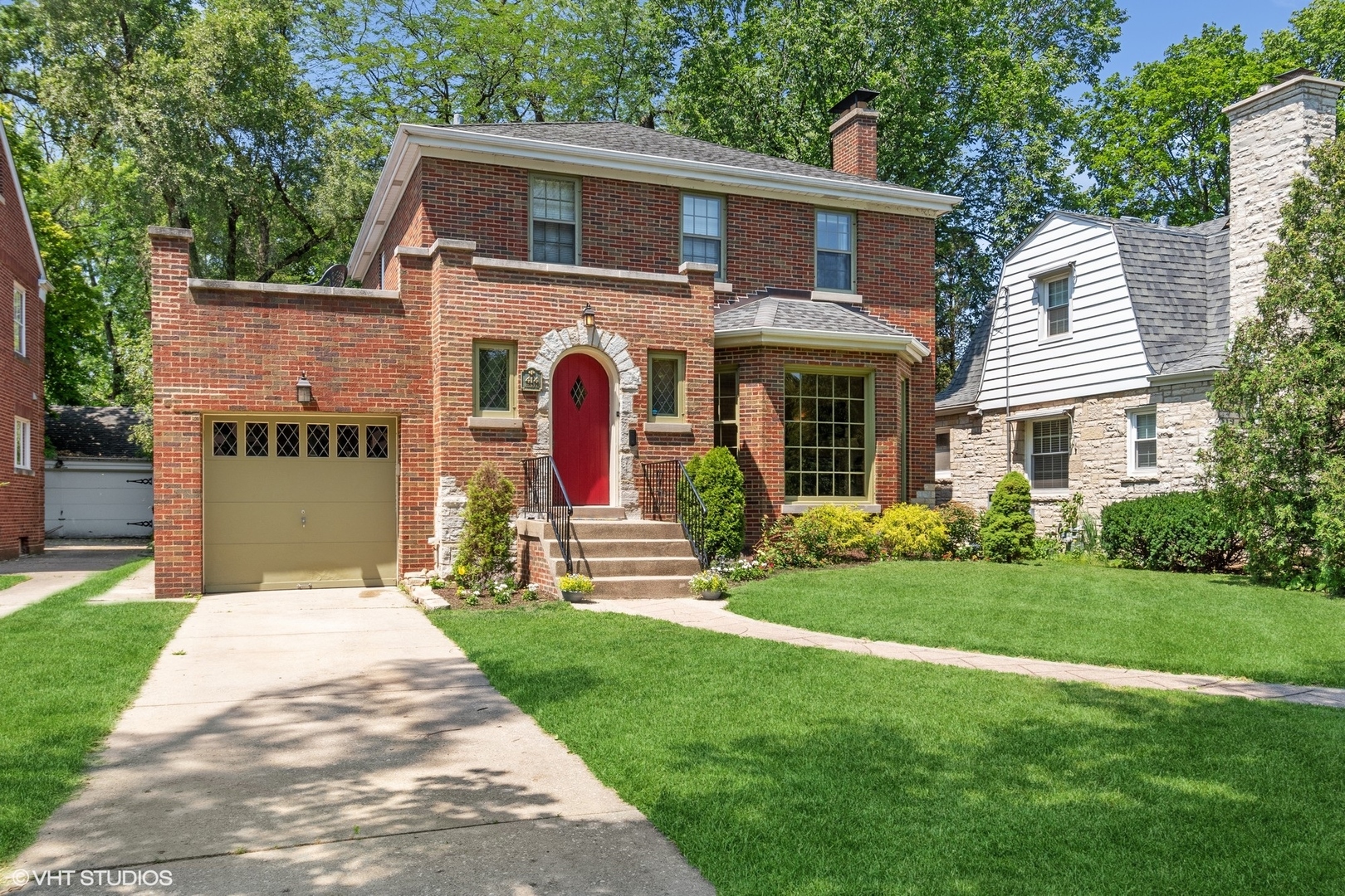 414 Audubon Road Riverside, IL 60546 - Photo 2 of 51 a front view of a house with a yard and porch