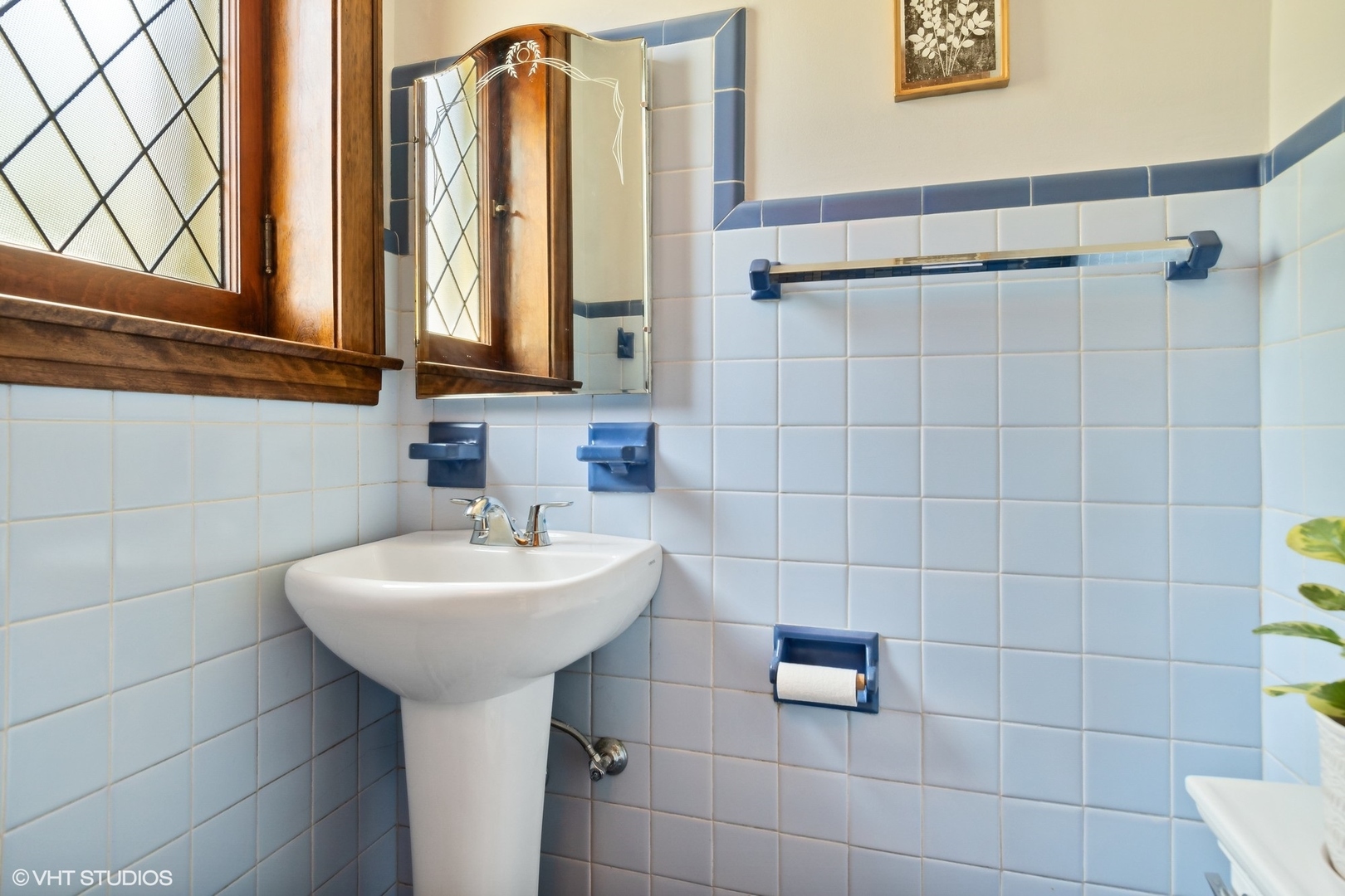 414 Audubon Road Riverside, IL 60546 - Photo 36 of 51 a bathroom with a sink a mirror and a shower