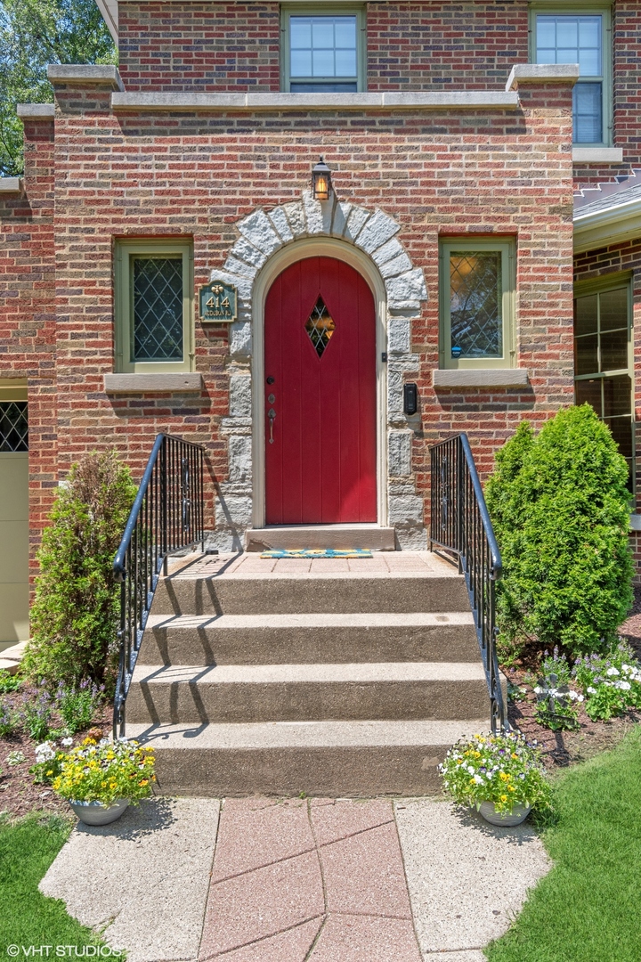 414 Audubon Road Riverside, IL 60546 - Photo 4 of 51 a front view of a house with plants