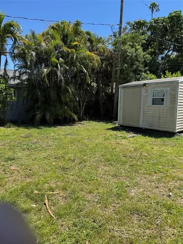 a view of backyard with green space