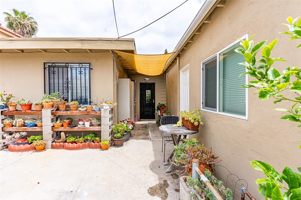 13809 Funston Avenue Norwalk, CA 90650 - Photo 11 of 16 a front view of a house with outdoor seating