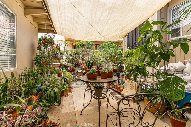 a view of a chairs and table in a patio