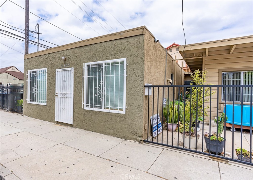 13809 Funston Avenue Norwalk, CA 90650 - Photo 5 of 16 a view of a house with backyard and glass door