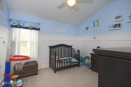 609 Racoon Court St. Johns, FL 32259 - Photo 12 of 32 a bedroom with a bed and a window
