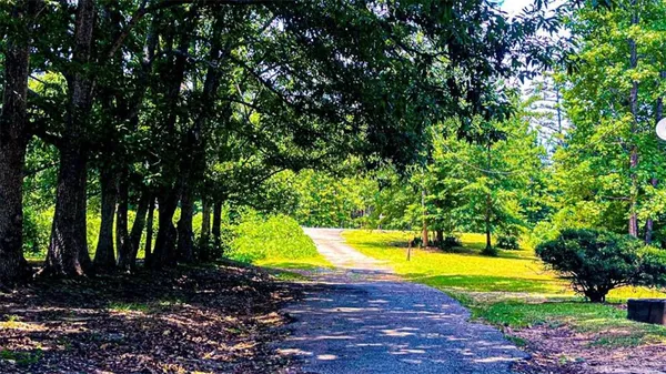 a view of a backyard with swimming pool