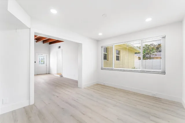 a view of livingroom with hardwood floor and hallway