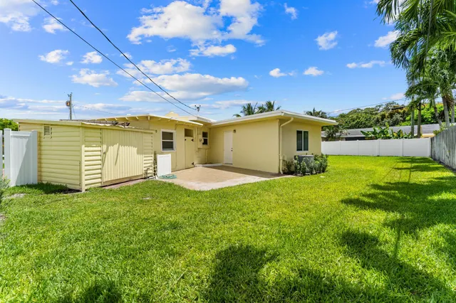 a view of a backyard of the house
