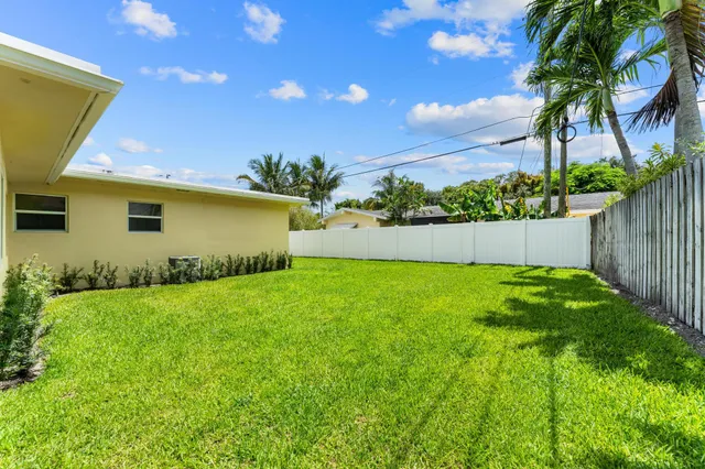 a view of yard with swimming pool