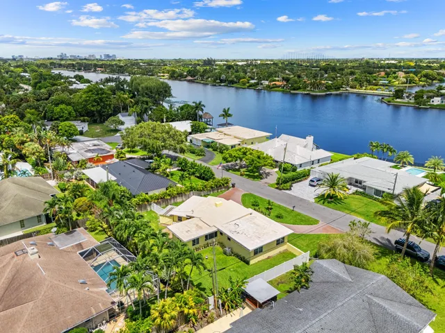 an aerial view of a house with a lake view