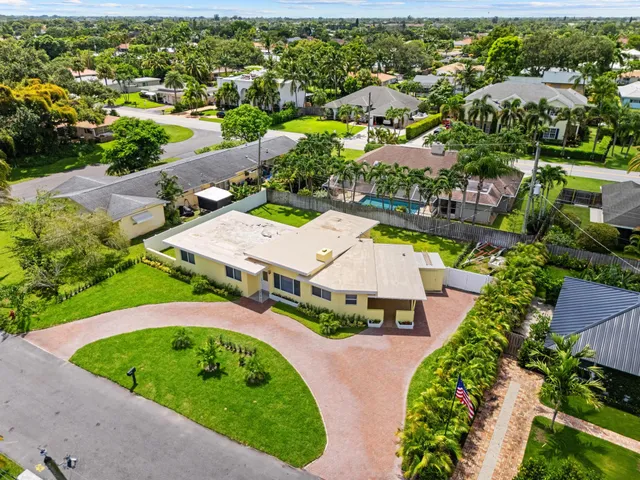 an aerial view of a house with a garden
