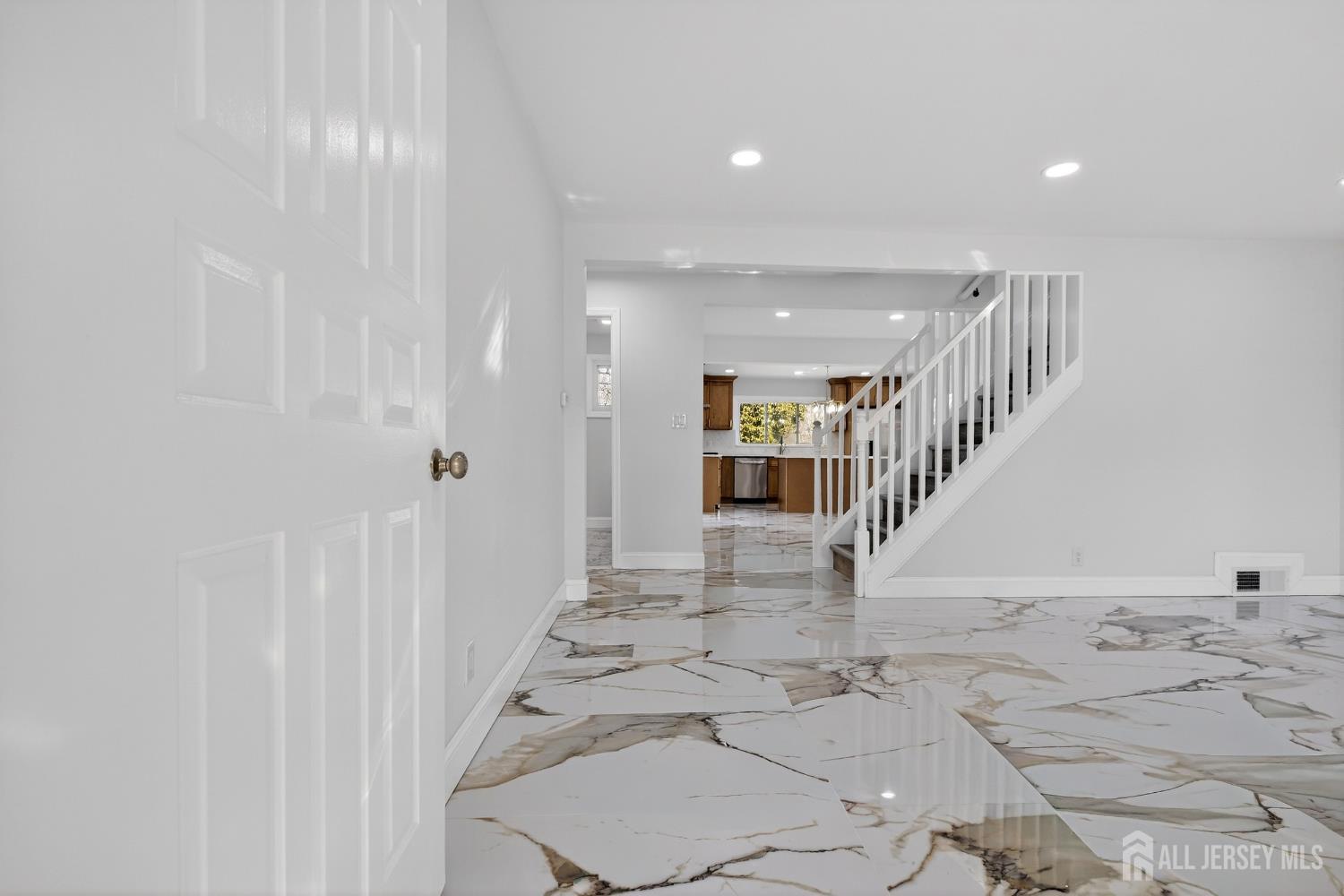 12 North Pennington Road New Brunswick, NJ 08901 - Photo 12 of 50 a view of entryway and hall with wooden floor