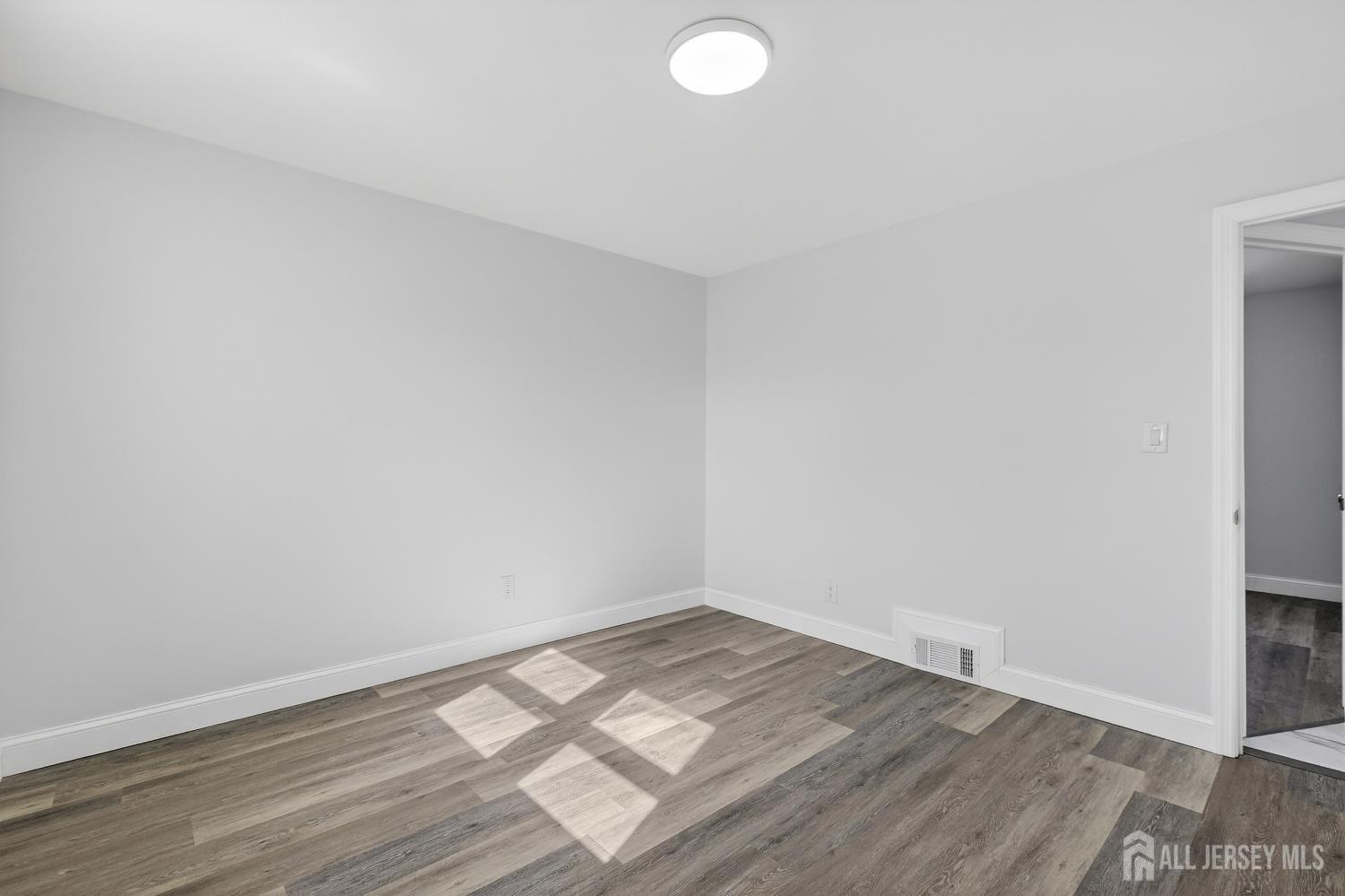 12 North Pennington Road New Brunswick, NJ 08901 - Photo 14 of 50 a view of empty room with wooden floor