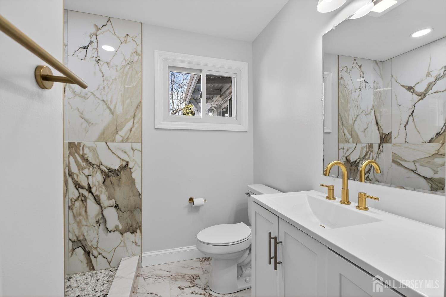 12 North Pennington Road New Brunswick, NJ 08901 - Photo 19 of 50 a bathroom with a sink a toilet and shower