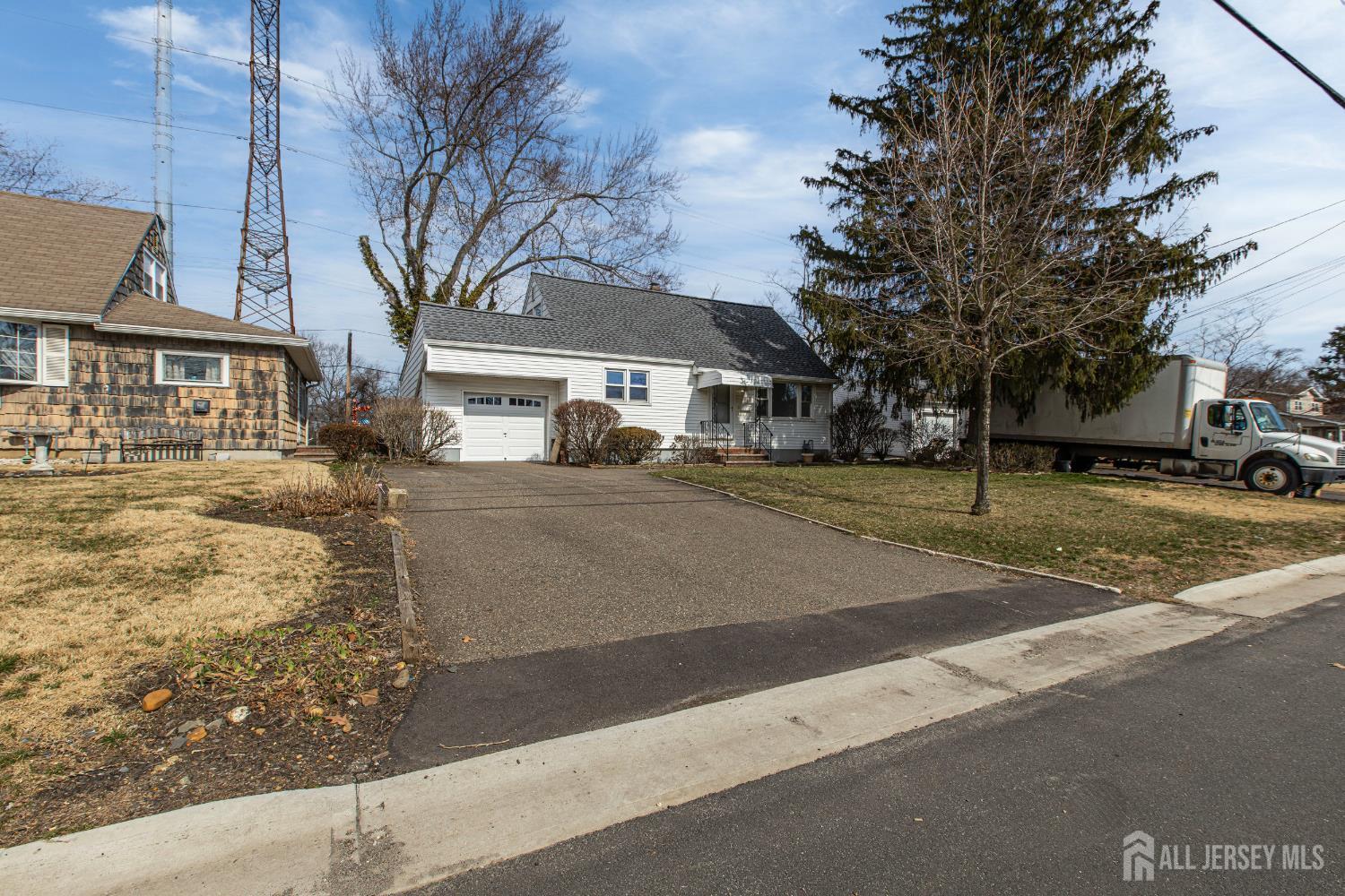 12 North Pennington Road New Brunswick, NJ 08901 - Photo 2 of 50 a view of a white house with a large tree