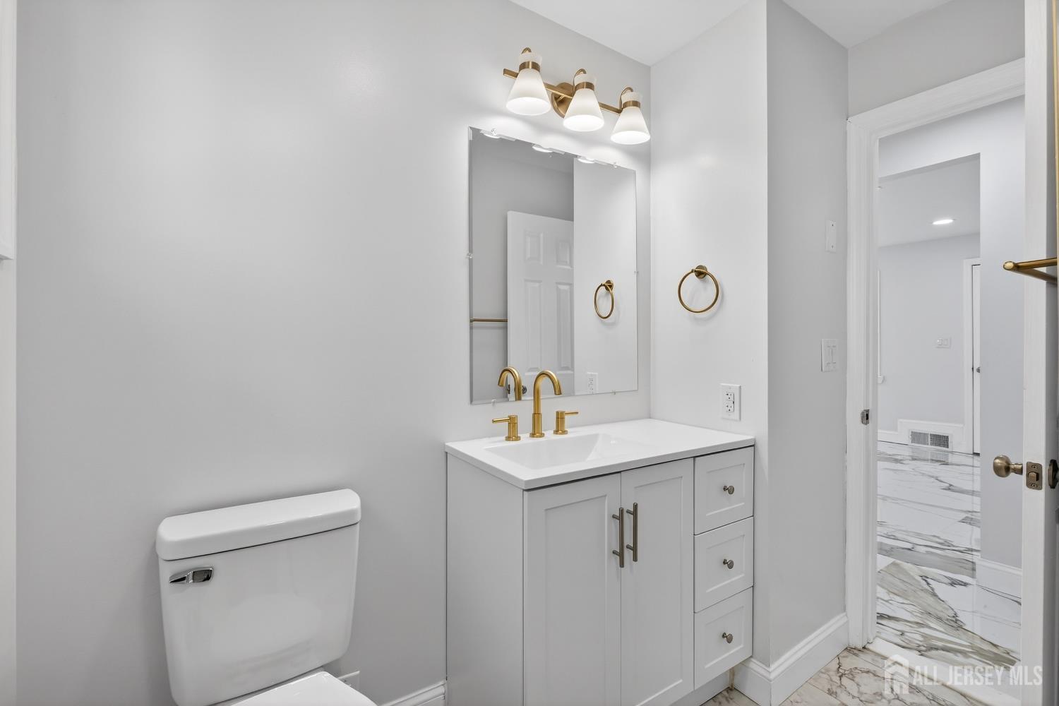 12 North Pennington Road New Brunswick, NJ 08901 - Photo 21 of 50 a bathroom with a sink a toilet and shower