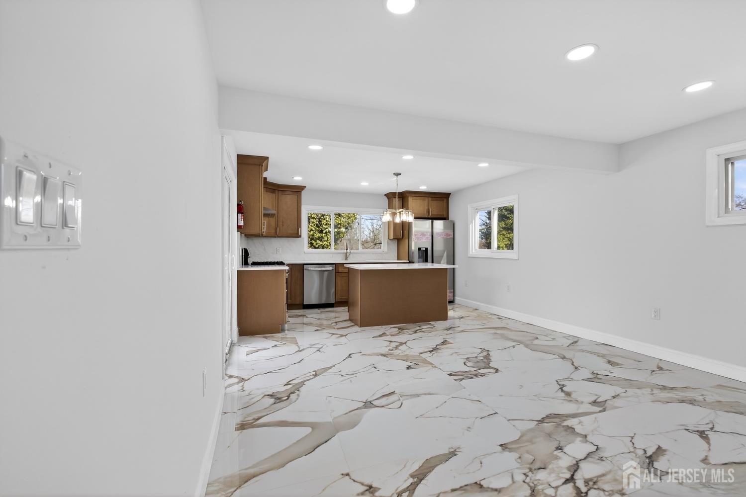 12 North Pennington Road New Brunswick, NJ 08901 - Photo 26 of 50 a view of kitchen with kitchen island microwave and refrigerator