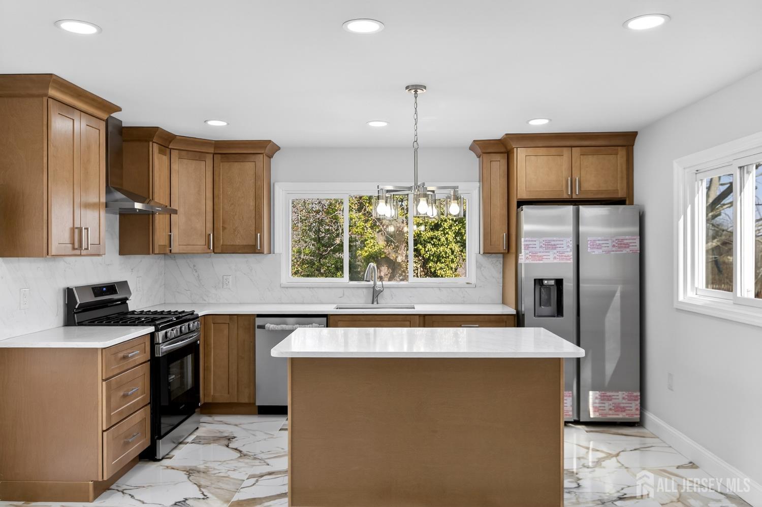 12 North Pennington Road New Brunswick, NJ 08901 - Photo 29 of 50 a kitchen with a sink stove and refrigerator