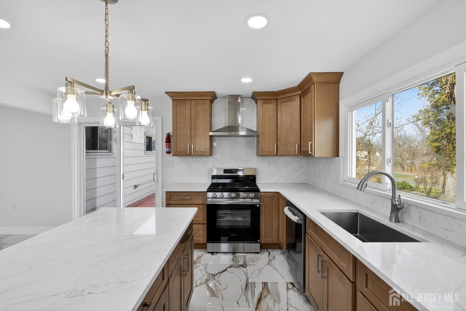 12 North Pennington Road New Brunswick, NJ 08901 - Photo 30 of 50 a kitchen with a sink a stove and cabinets