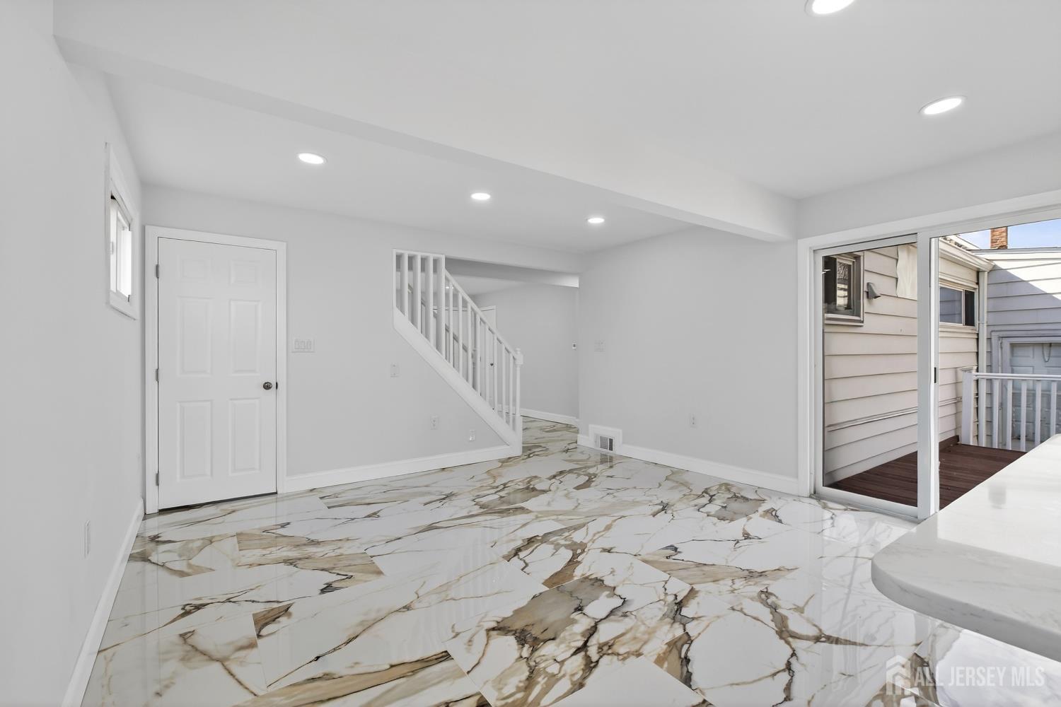 12 North Pennington Road New Brunswick, NJ 08901 - Photo 33 of 50 a view of a bedroom with a bed and wooden floor