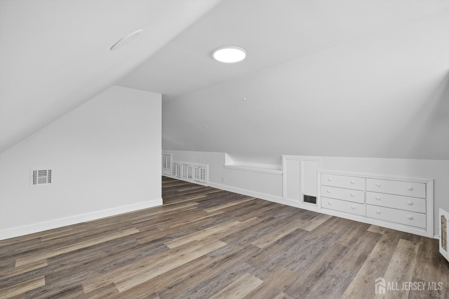 12 North Pennington Road New Brunswick, NJ 08901 - Photo 35 of 50 a view of an empty room with wooden floor