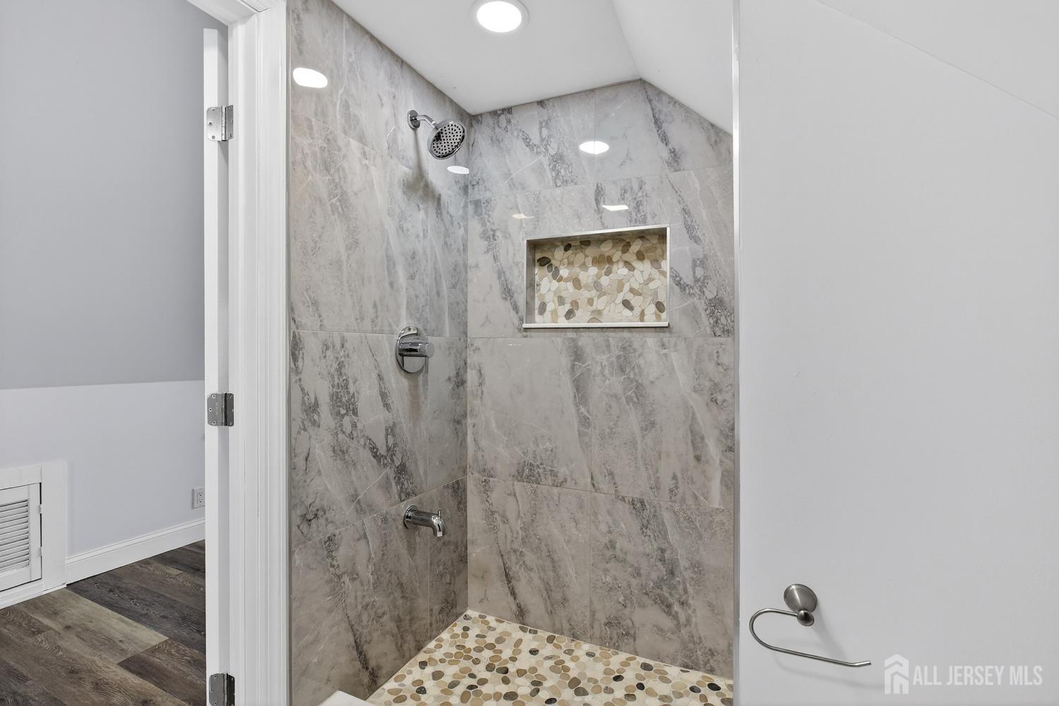 12 North Pennington Road New Brunswick, NJ 08901 - Photo 43 of 50 a bathroom with a shower and a sink