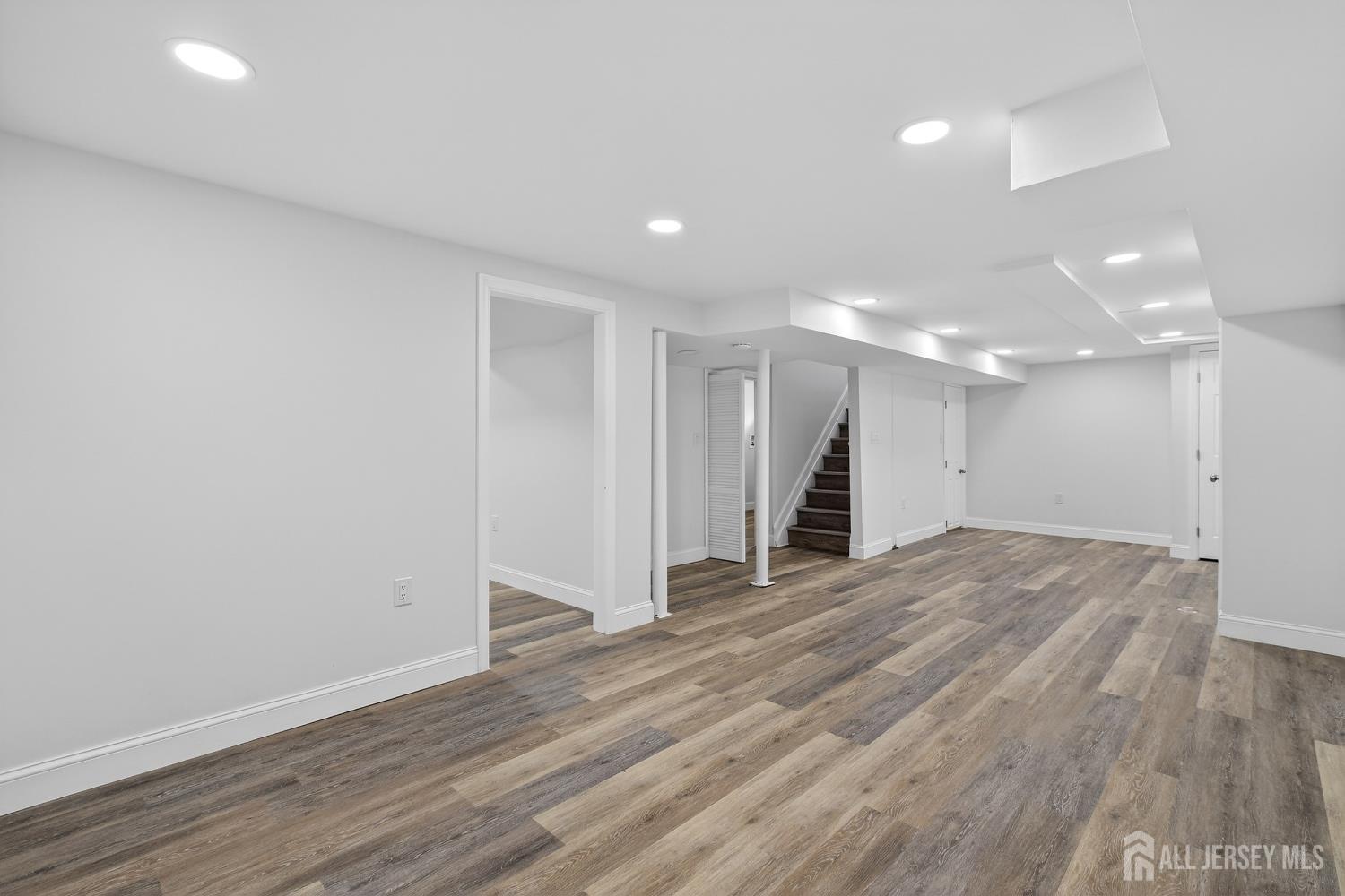 12 North Pennington Road New Brunswick, NJ 08901 - Photo 47 of 50 a view of an empty room with wooden floor