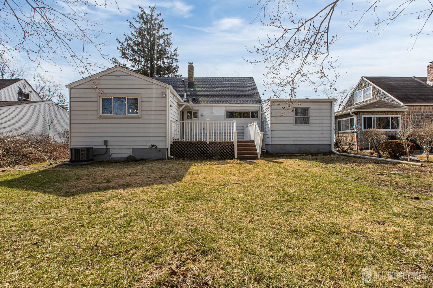 12 North Pennington Road New Brunswick, NJ 08901 - Photo 6 of 50 a front view of a house with a yard and garage