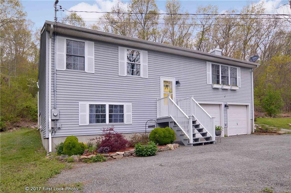 283 Snake Meadow Road Plainfield, CT 06354 - Photo 1 of 1 a view of a house with a yard and garage
