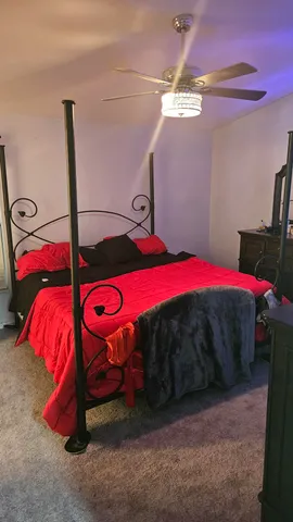 a view of a room with air conditioner and bed