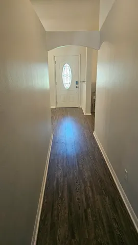 a view of a livingroom with wooden floor