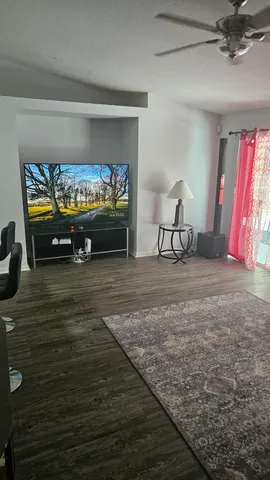 a view of room with furniture and a fireplace