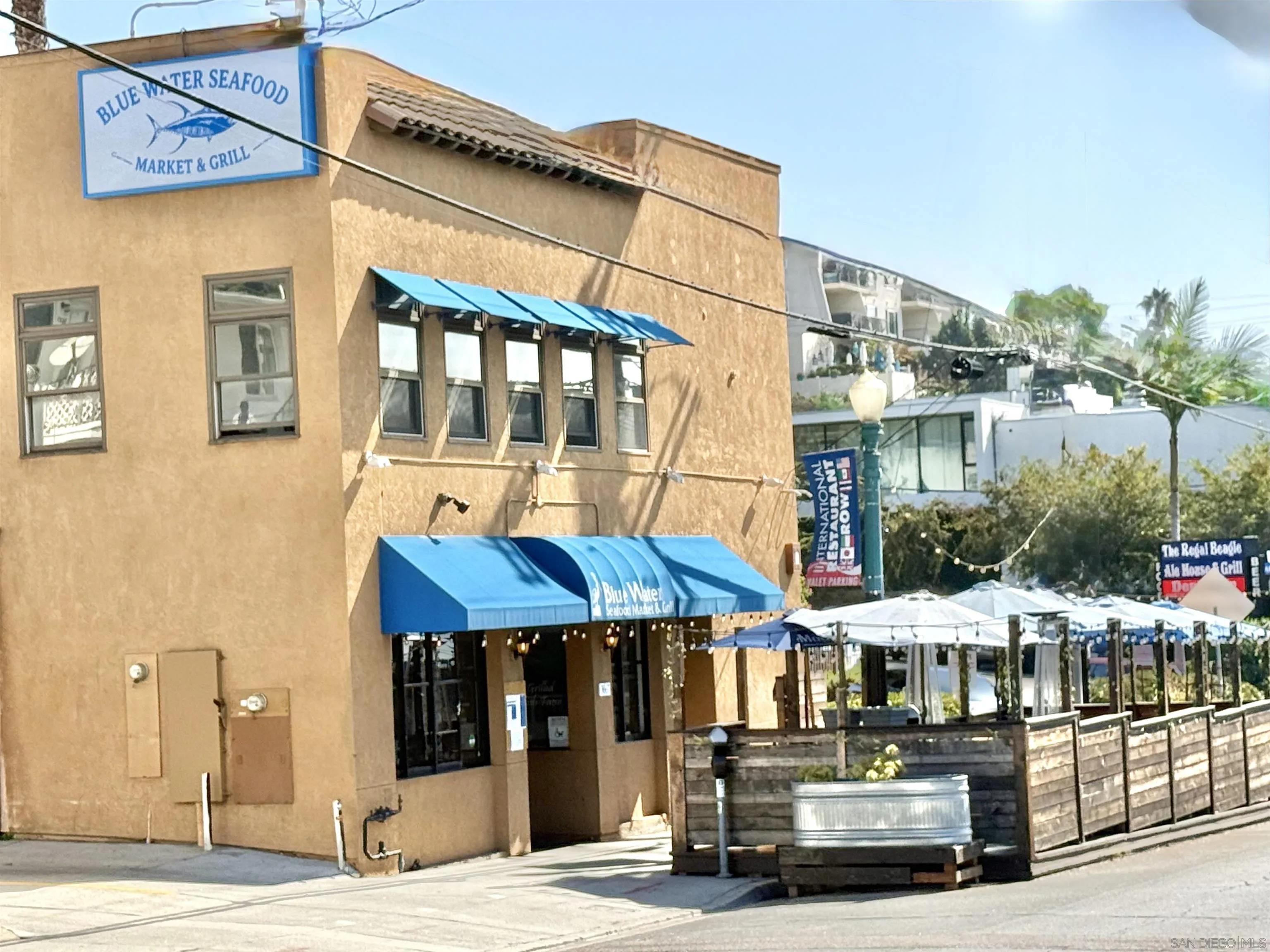 1670 Guy Street, Unit B San Diego, CA 92103 - Photo 44 of 44 a street view with tall buildings and lake view