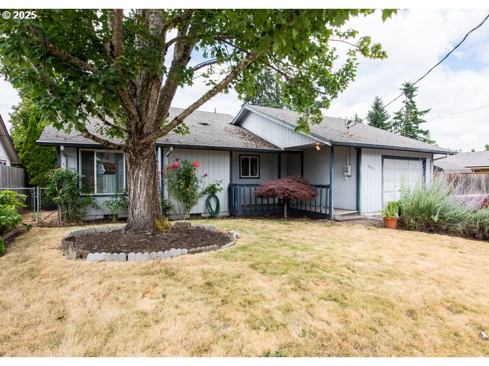 4631 Daisy Street Springfield, OR 97478 - Photo 1 of 46 a front view of a house with garden
