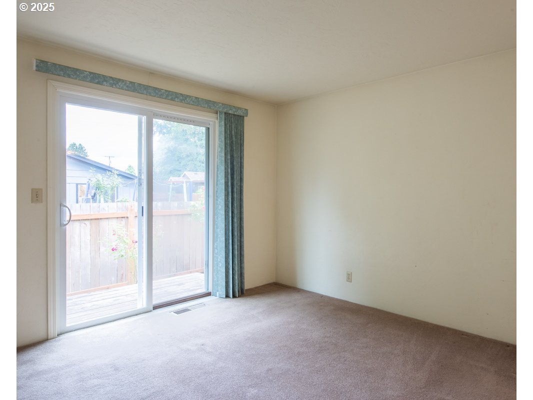4631 Daisy Street Springfield, OR 97478 - Photo 17 of 46 a view of an empty room with a window