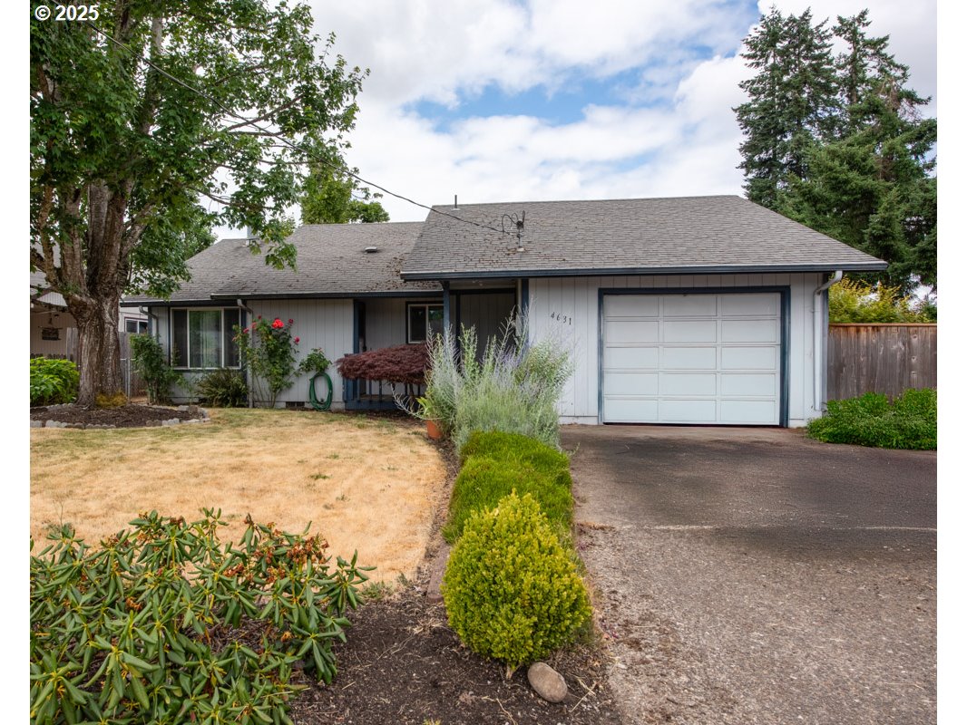 4631 Daisy Street Springfield, OR 97478 - Photo 2 of 46 a front view of a house with garden