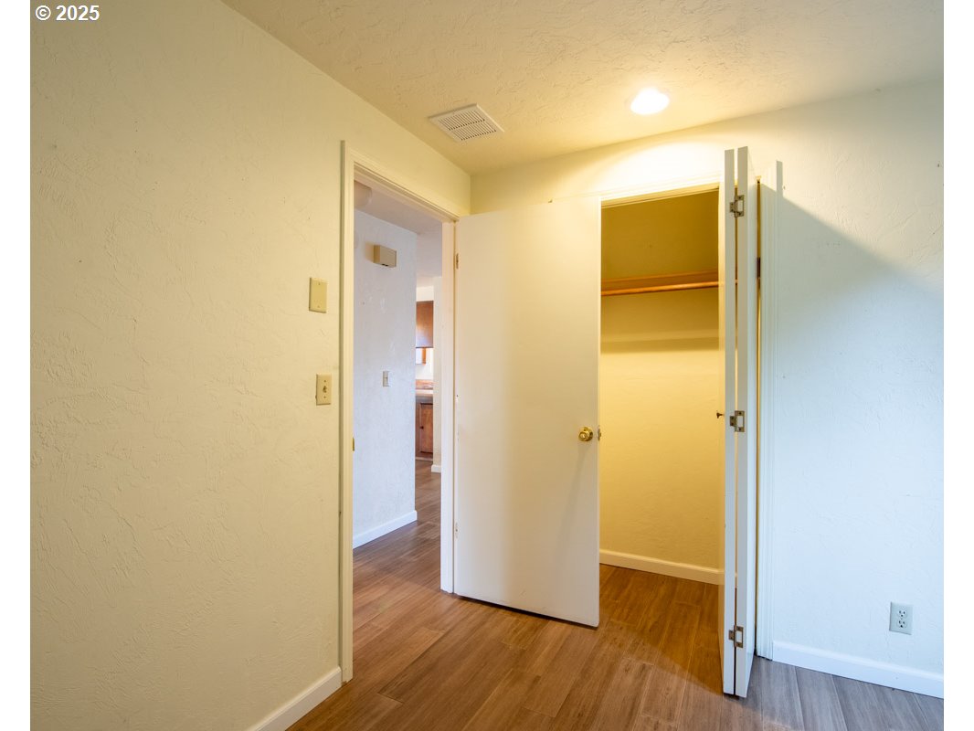 4631 Daisy Street Springfield, OR 97478 - Photo 27 of 46 a view of hallway with wooden floor