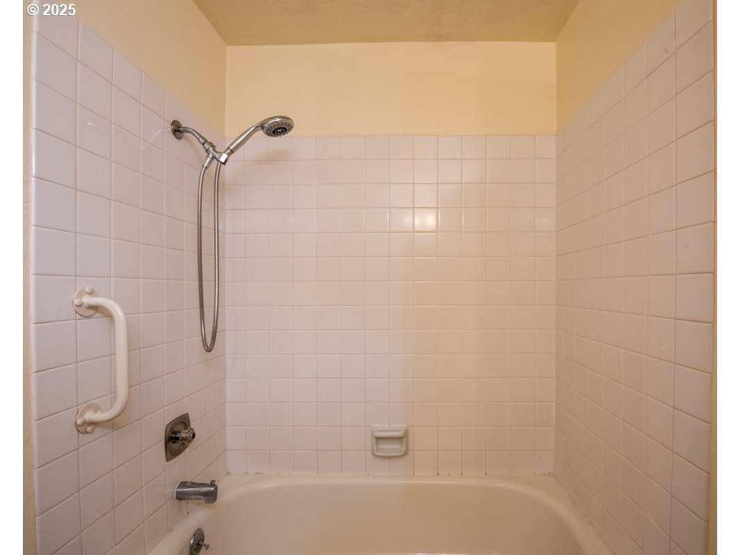 4631 Daisy Street Springfield, OR 97478 - Photo 32 of 46 a bathroom with a shower and a bath tub