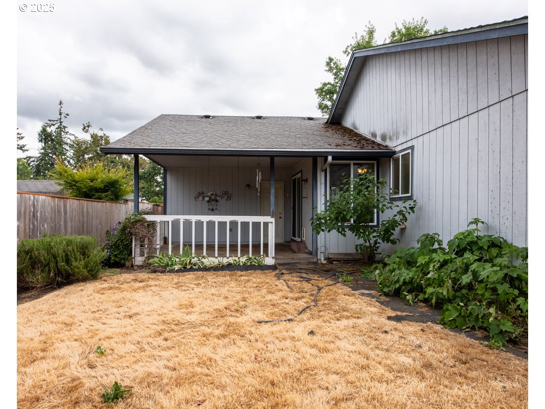 4631 Daisy Street Springfield, OR 97478 - Photo 39 of 46 a view of a house with wooden fence and a pathway