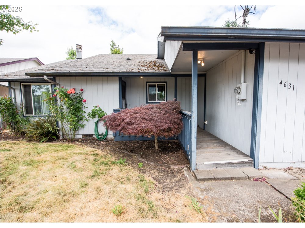 4631 Daisy Street Springfield, OR 97478 - Photo 4 of 46 a view of a house with wooden fence