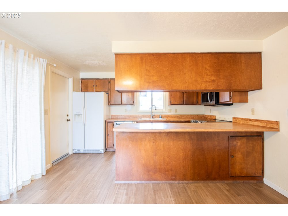4631 Daisy Street Springfield, OR 97478 - Photo 10 of 46 a living room with a wooden floor