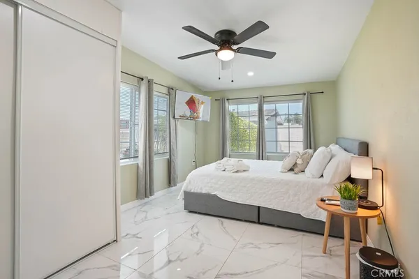 a bedroom with a bed and window