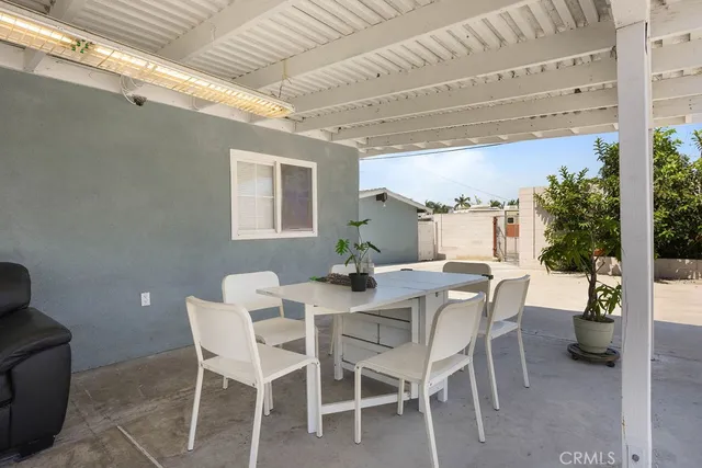 a view of a dining room with furniture and window