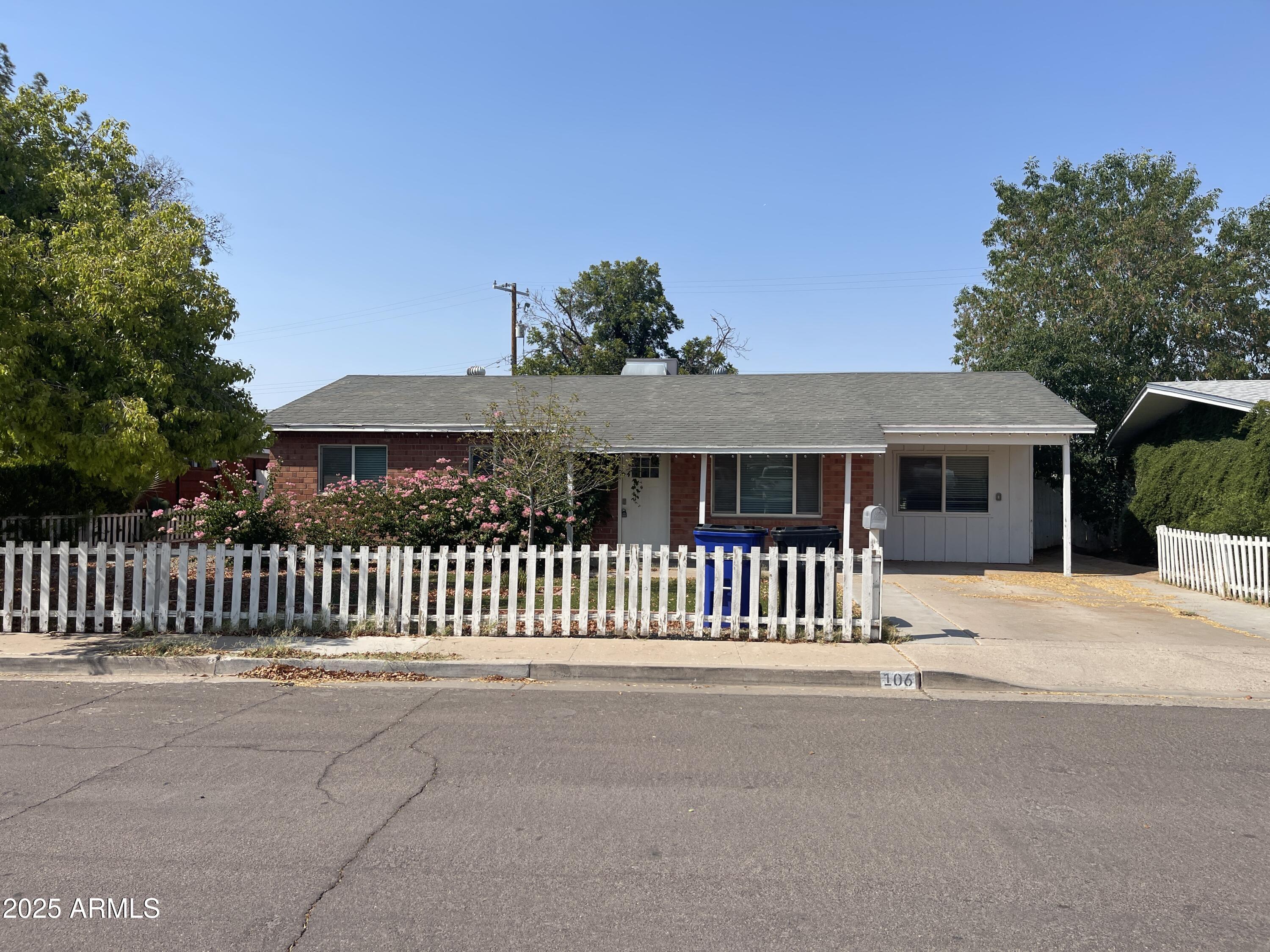 106 East Linda Lane Gilbert, AZ 85234 - Photo 1 of 21 a front view of a house with a garden