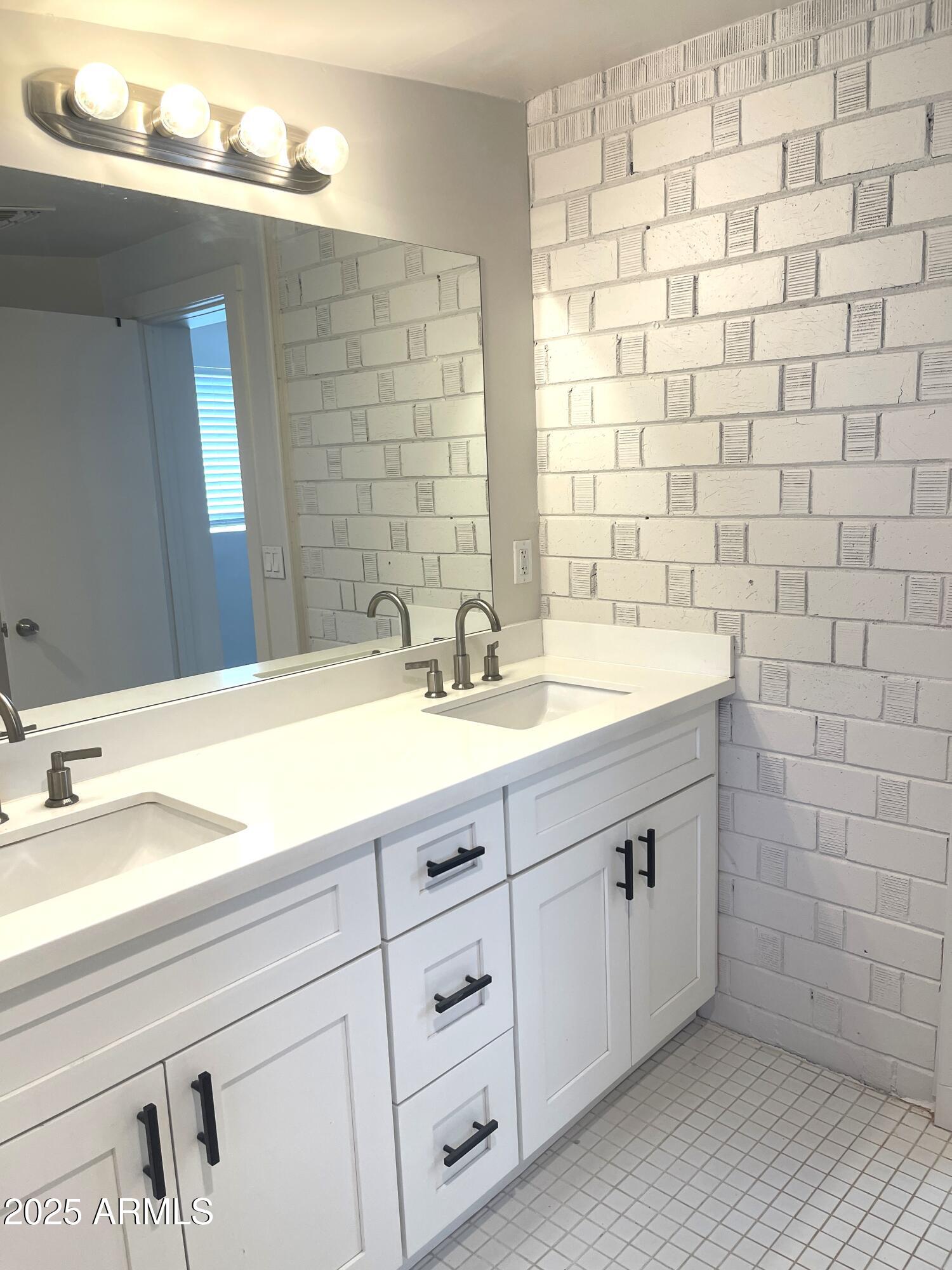 106 East Linda Lane Gilbert, AZ 85234 - Photo 18 of 21 a bathroom with a sink a vanity and a mirror