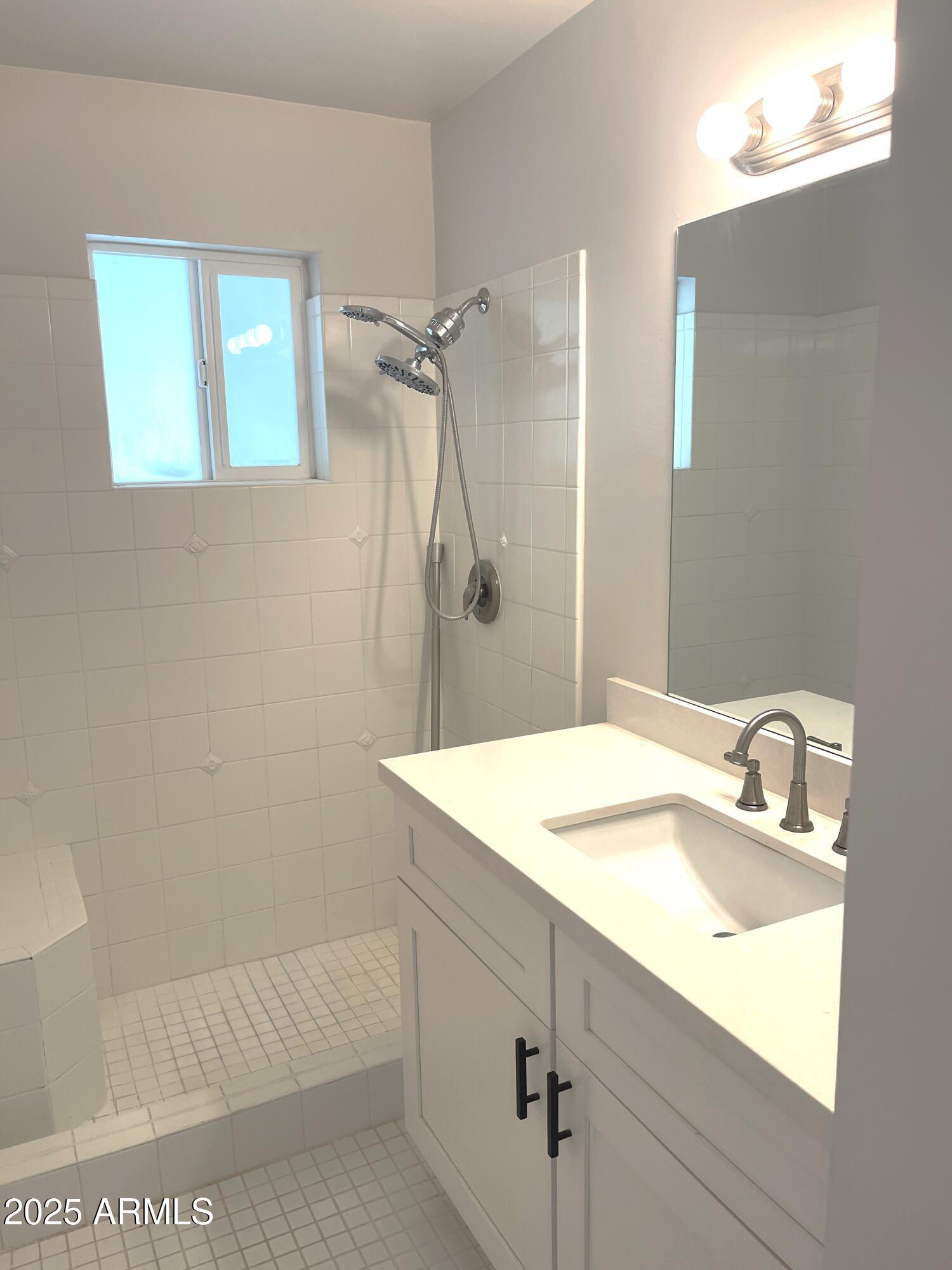 106 East Linda Lane Gilbert, AZ 85234 - Photo 20 of 21 a bathroom with a sink and a mirror