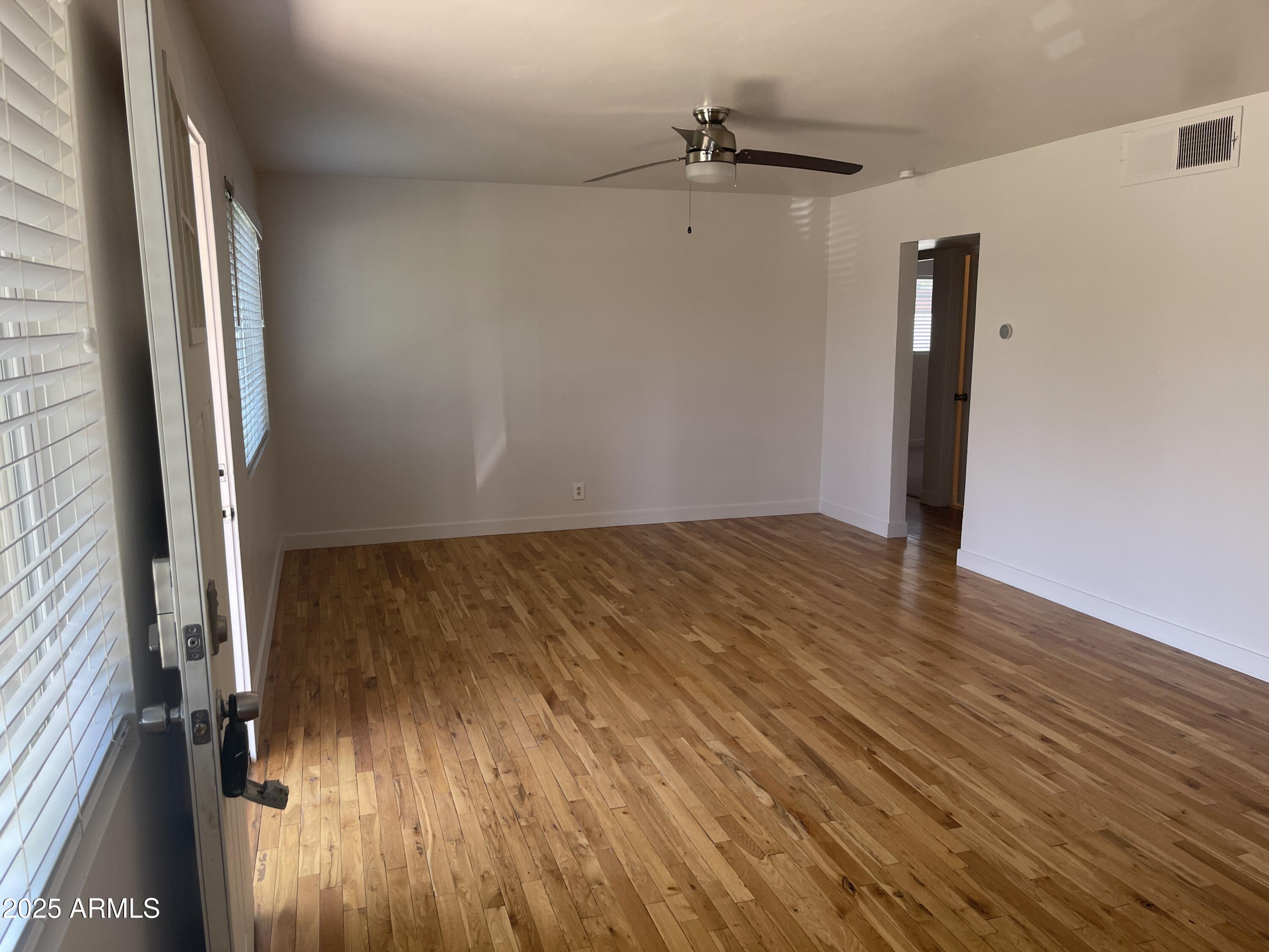 106 East Linda Lane Gilbert, AZ 85234 - Photo 2 of 21 wooden floor in an empty room