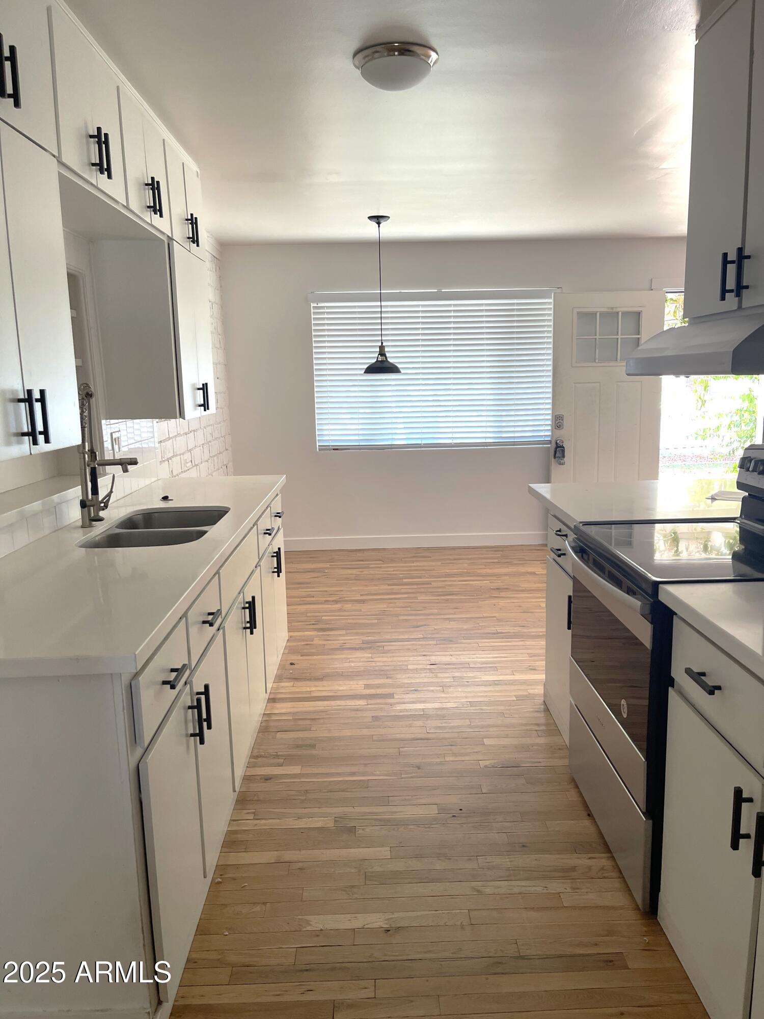 106 East Linda Lane Gilbert, AZ 85234 - Photo 6 of 21 a bathroom with a sink and a mirror