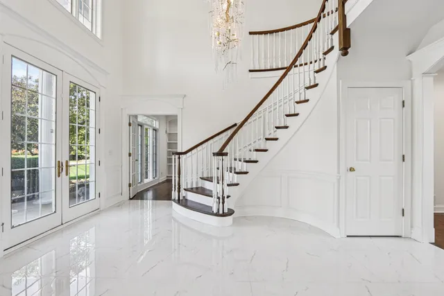 a bathroom with a sink toilet a mirror and shower